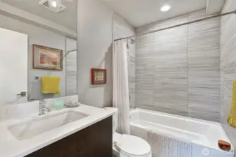 Shared second floor bathroom. Tile surround, Quartz counter.