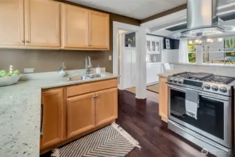 Updated kitchen with stainless steel appliances, stone counter-tops, and plenty of cabinet and counter space.