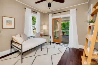 One of the main-level bedrooms easily doubles as an office or guest room, with access to the back covered deck.