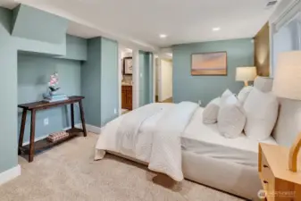 Primary bedroom with ensuite bath and two large walk-in closets.