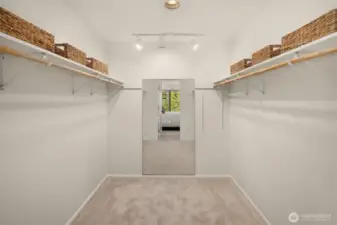 Primary bedroom walk-in closet
