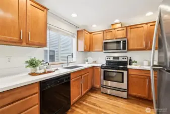 Whip up culinary masterpieces in this sleek kitchen, updated with new quartz counters and newer appliances.