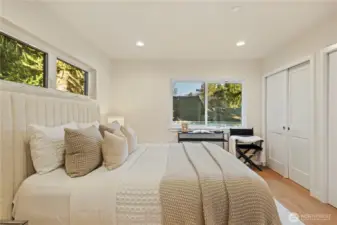 His and her closets in the primary. Spacious bedroom sizes!