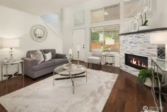 The family room is anchored by a stunning modern stone fireplace, perfect for those crisp PNW evening.