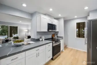 Fresh, modern kitchen updates include new countertops and stainless steel appliances