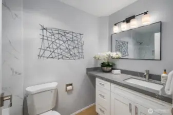 Stylish, updated full guest bathroom off of the hallway