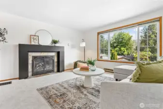 Upstairs living room with new carpet, fresh paint & gas fireplace.