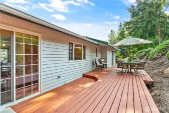 Sunny back deck with garden space.
