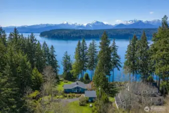 A view that stops you in your tracks... 150 feet of Hood Canal waterfront with the Olympic Mountains putting on a spectacular show, including Mt. Ellinor, Mt. Washington, The Brothers, and beyond.