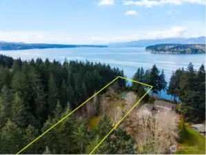 Set on 2.15 acres, this property offers more than just space... even the approach is lovely, with a fruit orchard nestled between the home and the fully paved entry.