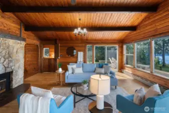 Another sliding glass door keeps the outdoors close at hand, and the vaulted ceilings make the space feel airy, open, and full of light. It’s the kind of room that feels instantly uplifting the moment you step in.