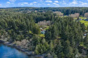 150 feet of high-bank waterfront... and the kind of setting that makes home feel less like an address and more like a destination you never want to leave.