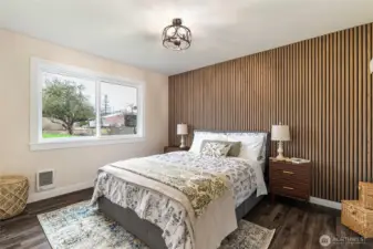 The second bedroom is also nicely sized. Queen sized bed with storage drawers for size reference.