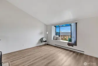 Bay window has a cozy seating area