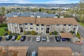 View of the building with carports and plenty of parking