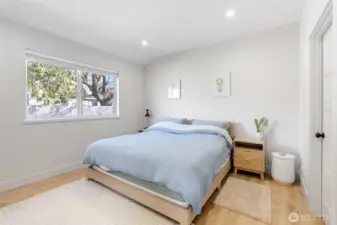Peaceful primary bedroom filled with natural light, featuring a spacious layout and a relaxing, private feel.