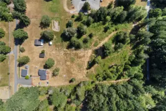 Arial view of property. Main home, detached garage, shed, barn, wood shed, chicken coop and seasonal pond make this a ready to go mini-farm.