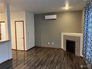 Nice electric fireplace along with ductless and wall heat provide comfort throughout the year. Alcove above fireplace is perfect  for your flat screen. Curtains are to slider to fenced backyard and deck for grilling and entertaining.