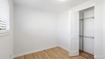 Guest bedroom with sizable closet.