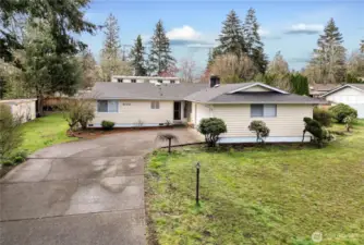 Classic, hard-to-find 4-bedroom rambler on a spacious .27-acre fully fenced lot in a desirable, established neighborhood with no HOA! This pristine, move-in ready home features a newer roof, fresh interior paint, new carpet, new blinds, updated insulation, and wide-plank laminate hardwoods in the entry, living, and hallway. The open and sprawling floorplan is ideal for entertaining or daily living. Enjoy energy-efficient comfort with vinyl windows and a heat pump with A/C. Both bathrooms have been updated with new vanities, flooring, mirrors, and faucets. Relax in the cozy sunroom or by one of two fireplaces. 2-car garage, extra parking, a garden shed, and plenty of yard space for gardening or play. Welcome home!
