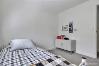 Bedroom 3 - This charming third bedroom is freshly painted with brand new carpet and upgraded closet shelving, offering the perfect blend of comfort and convenience. Tucked away from the main living spaces, it’s a great option for guests or a dedicated work-from-home setup.