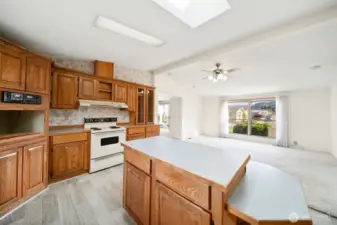 Kitchen (with skylights), looking back towards primary bedroom and family room.
