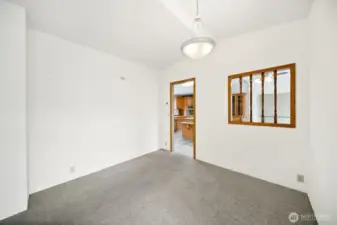 Dining area looking into kitchen.