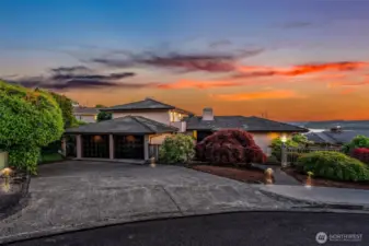 Two car attached garage with ample driveway parking for guests.