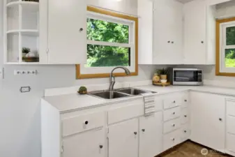 Complete with a large window above the kitchen sink for enjoying the view while washing dishes