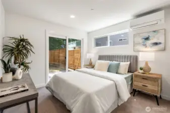 Main floor bedroom opens to fenced back yard