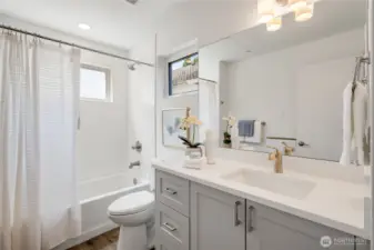 Tile surround and quartz countertops
