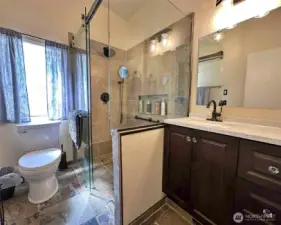 Main bathroom with heated floors walk in shower.