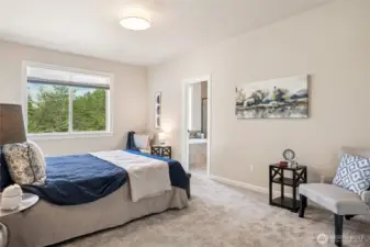 The primary bedroom is a restful retreat with outdoor access and its own elegant ensuite.