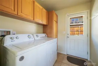 Laundry with door to back yard