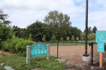 Newport Hills Woodlawn Park nearby, offering off-leash dog play area, large grassy field, trail access, and more.
