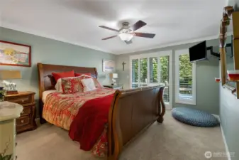 Roomy primary bedroom w/french doors to private deck and view.