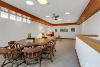 Expansive upstairs bonus room w/gorgeous woodwork  & french doors to balcony w/amazing view.