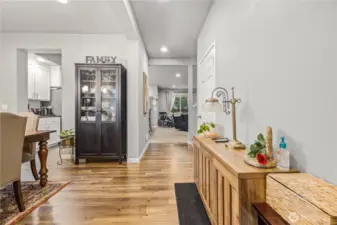 Bright, inviting entry opens into a thoughtfully designed floor plan featuring luxury vinyl plank floors, neutral tones, and seamless flow into the main living spaces.