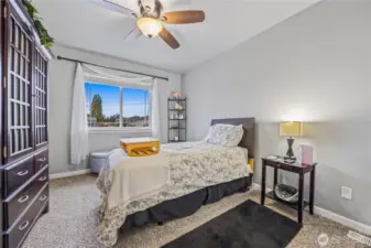 Bedroom 4 - Inviting upstairs bedroom featuring neutral tones, plush carpet, and a peaceful view—perfect as a guest room or flex space.