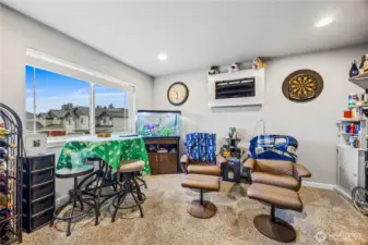 Upstairs Bonus Room / Flex Space currently used as a media space (man cave). Ideal for a home office, lounge, or playroom.