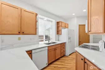 Galley like kitchen with sink overlooked by the window