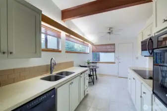 When you first walk into the entry the kitchen is on your left.