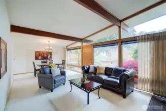 Dining room and living room feature floor to ceiling windows that bring in lots of natural light.