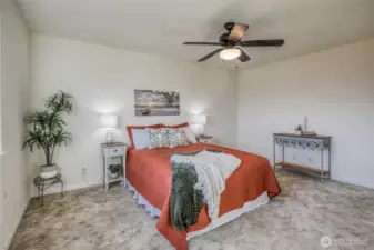 Large bottom floor Primary Bedroom. 3/4 bathroom is conveniently located right outside the door.