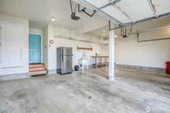 Storage, extra refrigerator, wash sink and work bench, everything the perfect garage needs.