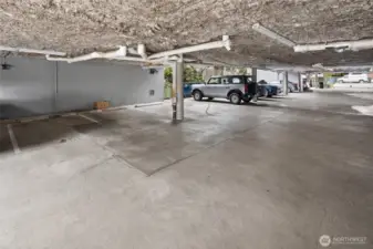 Secure, covered parking space #4 plus a dedicated storage unit located in the bank directly in front of the parking spot - easy in, easy out.