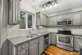 Kitchen window over looks back yard.