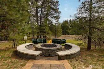 gas fire pit with stadium chairs and built in stone seating