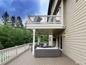 Lower deck with rain system ceiling so it stays dry year round. Exterior wall mounted tv conveys