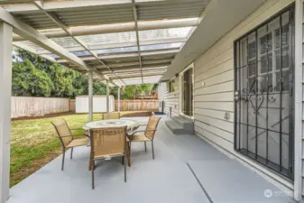 Concrete Patio w/overhang, freshly painted patio. Don't miss the large shed in the corner!